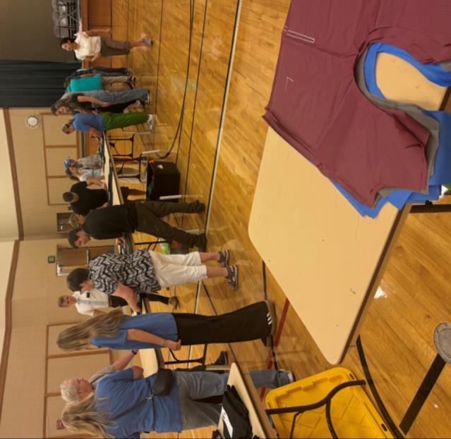 WIN community members making warm vests for unhoused neighbors.